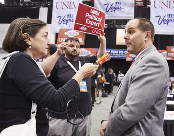 Media Relations Specialist Francis McCabe (center) helped shepherd political science professor David Damore through Spin Alley during the Presidential Debate on Oct. 19, 2016. (Josh Hawkins/UNLV Photo Services)