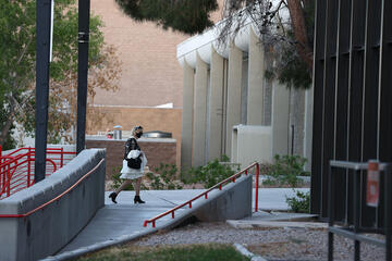 woman walking into building