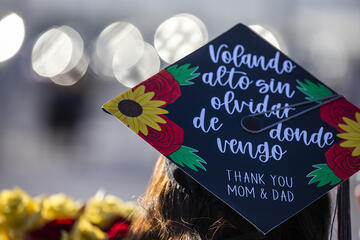 Grad cap decorated with illustrative message