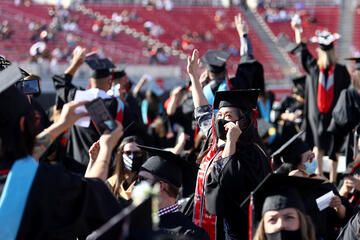 graduates waving 