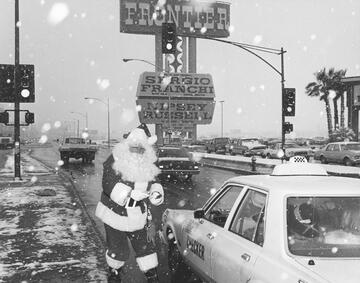 man in santa costume in the snow