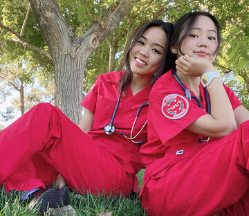 two nursing students outdoors