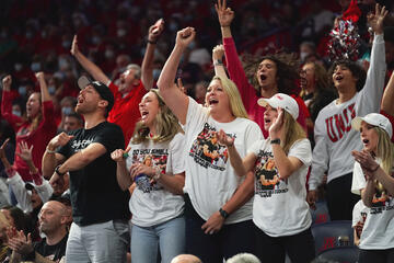 Fan cheering on the UNLV Lady Rebels during the 2022 NCAA tournament