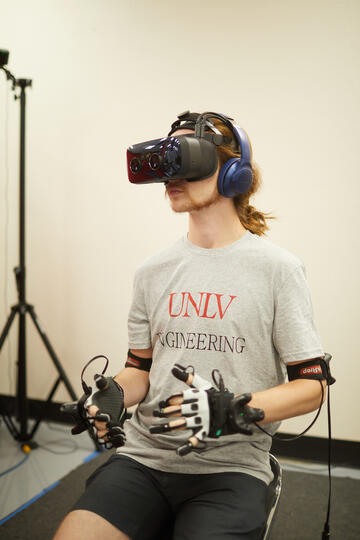 student using VR to move robot
