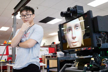 Truc Tran working with the Avator-Hubo robot. (Josh Hawkins)