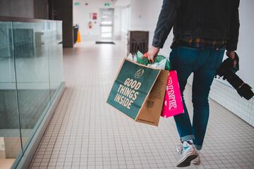 mall shopper holding bags