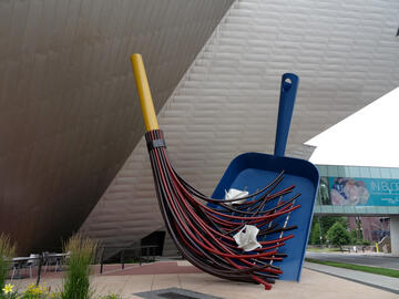 sculpture called "Big Sweep" with large sweeper and dustpan