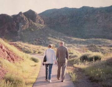 couple walking along a nature path