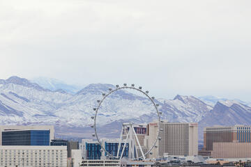 Las Vegas strip with snowy mountains in background