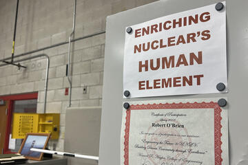 sign posted in lab space saying "enriching nuclear's human element"