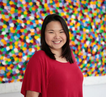 woman posing in front of colorful background