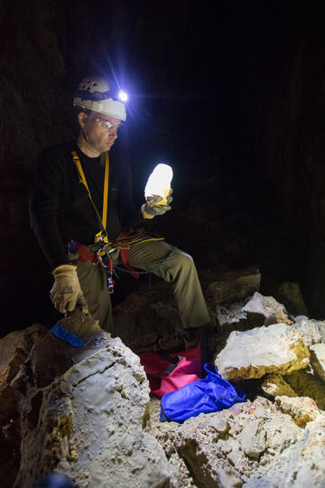 UNLV professor Matthew Lachniet holds a stalagmite retrieved from a Grand Canyon cave