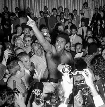 archive photo of boxer celebrating amid crowd
