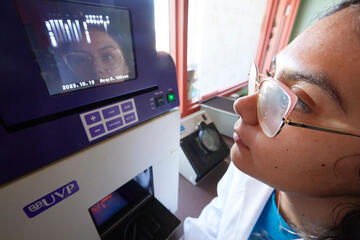 close-up shot of woman reading data on equipment screen