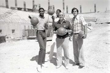 coach and two basketball players at construction site