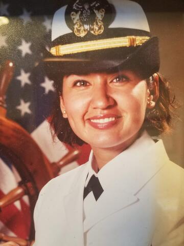 portrait of woman in white military service uniform