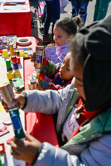 children at booth at holiday event