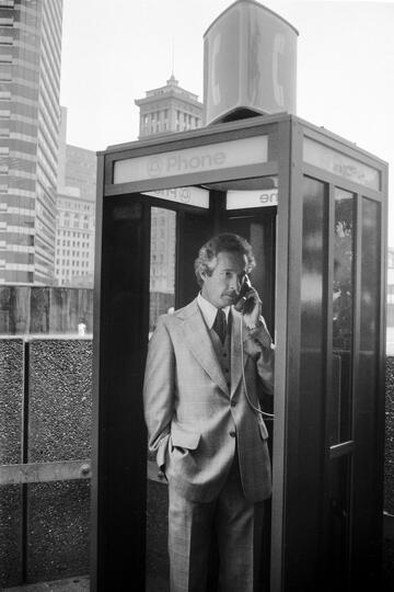 archival photo of man in phone booth