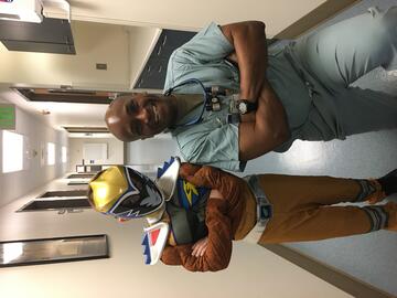 Dr. Kersey poses with young patient dressed as a Power Ranger