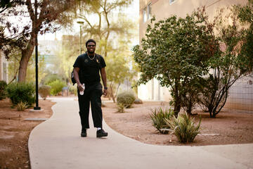 Terrence Boyd-Weatheroy walks down a sidewalk 