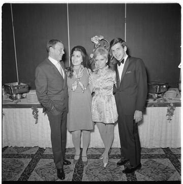 Frank Sinatra and others attend a party