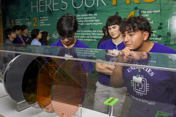 students observe wafer during field trip
