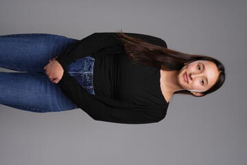 student posing in a black sweater