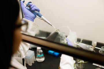 A researcher working in UNLV professor Libby Hausrath's lab