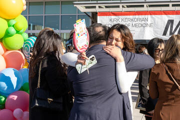 Class of 2023 medical student hugging her family at Match Day