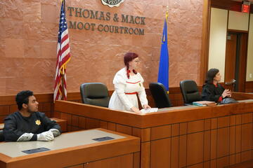 actors reenacting Crime &amp; Punishment in Thomas &amp; Mack moot courtroom