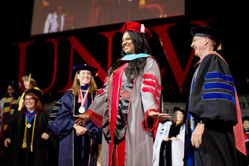 Ashley Pruitt graduates with a Doctorate of Public Policy at commencement.