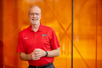 Chris Heavey in red Rebel athletic polo