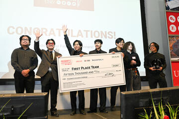 winning team holds check