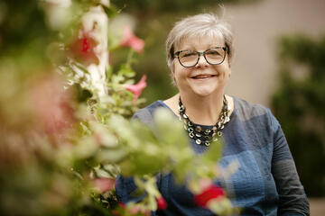 Anni Drury with flowers in the foreground