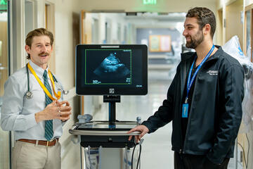 Edwin Avallone, DO (left), with third-year, internal medicine resident Ryan Parto, MD (right).
