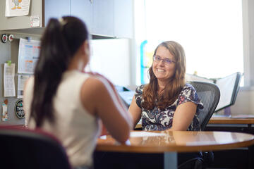 two women meeting in an office