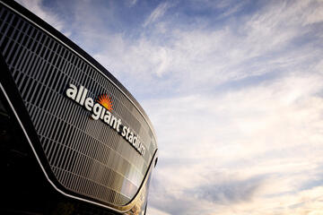 exterior of Allegiant stadium with wispy clouds in background