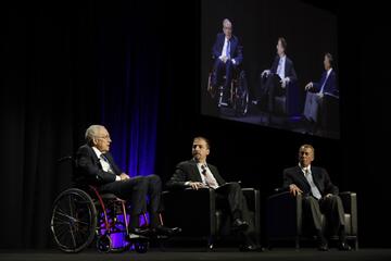 Chuck Todd, host of NBC's Meet the Press, moderates a discussion at the Bellagio in Las Vegas between former U.S. Sen. Harry Reid and former Speaker of the House John Boehner.