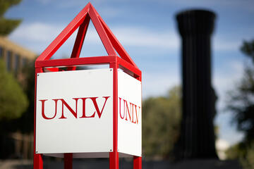 UNLV sign with flashlight in background