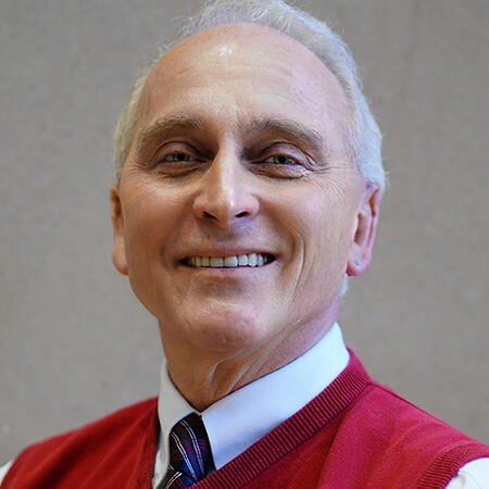 A man in a suit smling