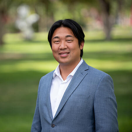 man wearing a greyish blue suit