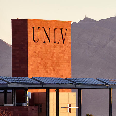 A part of a building with UNLV letters etched