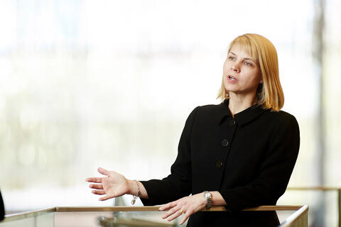 A woman gestures while talking