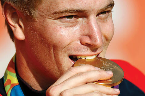 Connor Fields bites his gold medal