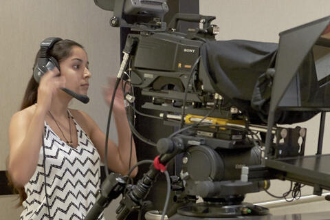 Student operating a tv camera