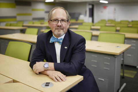 man in empty classroom
