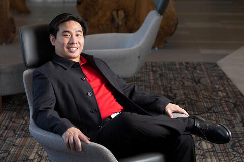 A man reclines in a chair