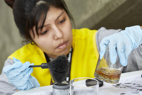 woman using fingerprinting equipment