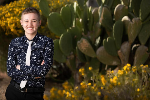 Alice Hasings standing next to a cactus