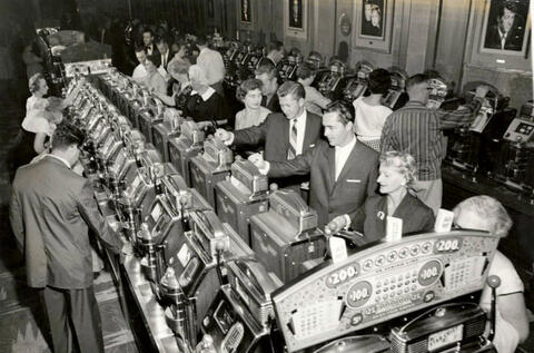 Hotel guests gamble at the slots